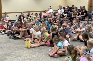 large group of kids at library