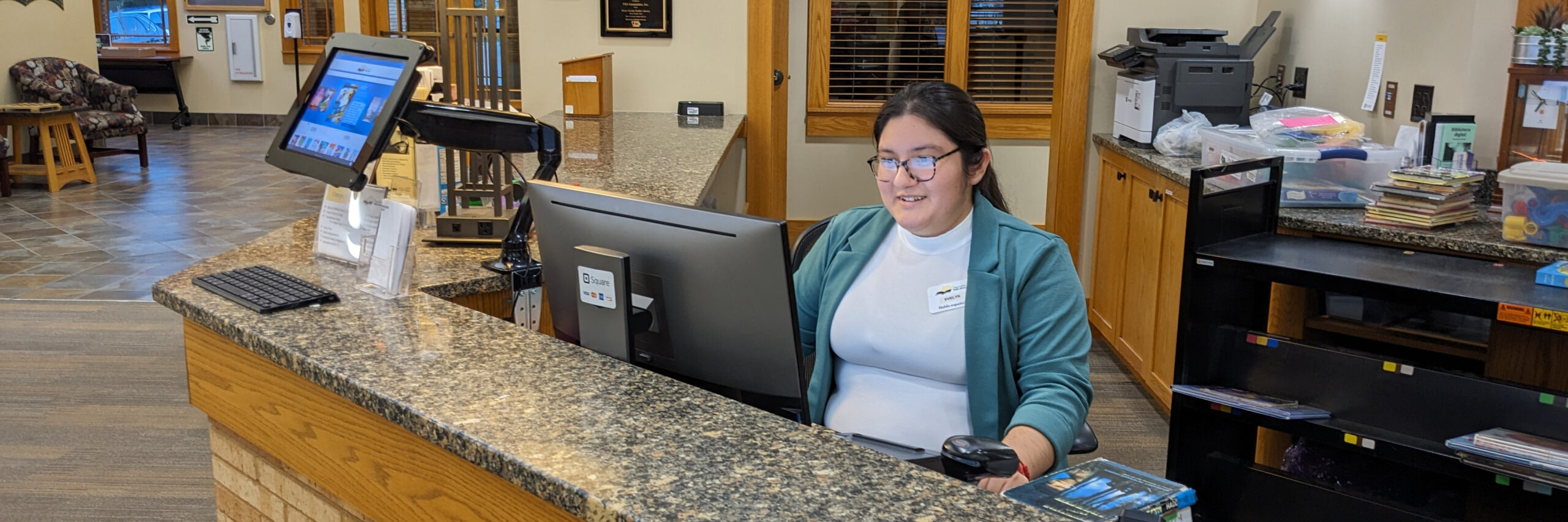 Librarian at circulation desk